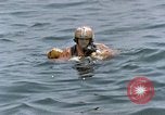 Image of jet pilot water rescue United States USA, 1965, second 42 stock footage video 65675027024