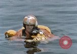 Image of jet pilot water rescue United States USA, 1965, second 44 stock footage video 65675027024