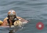Image of jet pilot water rescue United States USA, 1965, second 45 stock footage video 65675027024