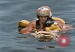 Image of jet pilot water rescue United States USA, 1965, second 46 stock footage video 65675027024