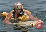 Image of jet pilot water rescue United States USA, 1965, second 49 stock footage video 65675027024