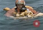 Image of jet pilot water rescue United States USA, 1965, second 51 stock footage video 65675027024