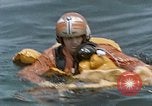 Image of jet pilot water rescue United States USA, 1965, second 52 stock footage video 65675027024