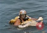 Image of jet pilot water rescue United States USA, 1965, second 53 stock footage video 65675027024