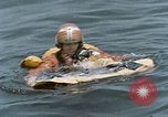 Image of jet pilot water rescue United States USA, 1965, second 54 stock footage video 65675027024