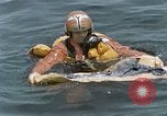 Image of jet pilot water rescue United States USA, 1965, second 55 stock footage video 65675027024