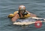 Image of jet pilot water rescue United States USA, 1965, second 56 stock footage video 65675027024