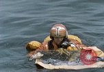 Image of jet pilot water rescue United States USA, 1965, second 57 stock footage video 65675027024