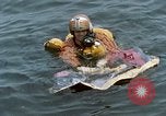 Image of jet pilot water rescue United States USA, 1965, second 62 stock footage video 65675027024