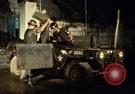 Image of M 151 armored jeep Saigon Vietnam, 1967, second 33 stock footage video 65675027026