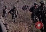 Image of United States soldiers on patrol in Vietnam War Vietnam, 1967, second 13 stock footage video 65675027034