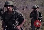 Image of United States soldiers on patrol in Vietnam War Vietnam, 1967, second 22 stock footage video 65675027034