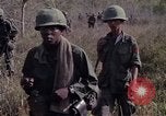 Image of United States soldiers on patrol in Vietnam War Vietnam, 1967, second 25 stock footage video 65675027034