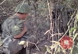Image of United States soldiers on patrol in Vietnam War Vietnam, 1967, second 32 stock footage video 65675027034