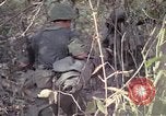 Image of United States soldiers on patrol in Vietnam War Vietnam, 1967, second 33 stock footage video 65675027034