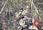 Image of United States soldiers on patrol in Vietnam War Vietnam, 1967, second 46 stock footage video 65675027034