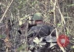 Image of United States soldiers on patrol in Vietnam War Vietnam, 1967, second 47 stock footage video 65675027034