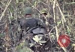 Image of United States soldiers on patrol in Vietnam War Vietnam, 1967, second 49 stock footage video 65675027034