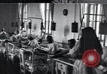 Image of Patients in hospital tended by nuns Vienna Austria, 1923, second 30 stock footage video 65675027115