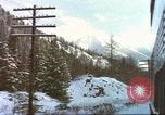 Image of Passenger train in snowy mountains United States USA, 1985, second 1 stock footage video 65675027198
