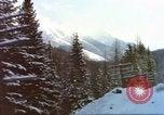 Image of Passenger train in snowy mountains United States USA, 1985, second 15 stock footage video 65675027198