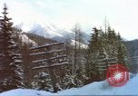 Image of Passenger train in snowy mountains United States USA, 1985, second 17 stock footage video 65675027198