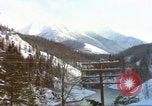 Image of Passenger train in snowy mountains United States USA, 1985, second 25 stock footage video 65675027198