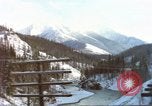Image of Passenger train in snowy mountains United States USA, 1985, second 26 stock footage video 65675027198