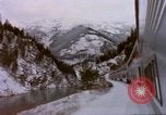Image of Passenger train in snowy mountains United States USA, 1985, second 40 stock footage video 65675027198