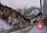Image of Passenger train in snowy mountains United States USA, 1985, second 43 stock footage video 65675027198