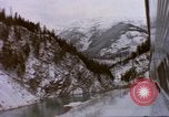 Image of Passenger train in snowy mountains United States USA, 1985, second 44 stock footage video 65675027198