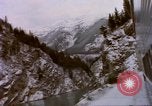 Image of Passenger train in snowy mountains United States USA, 1985, second 49 stock footage video 65675027198