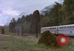 Image of Amtrak passenger train passing by United States USA, 1985, second 23 stock footage video 65675027205