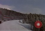 Image of Passenger train on snow covered mountain United States USA, 1985, second 13 stock footage video 65675027211