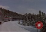 Image of Passenger train on snow covered mountain United States USA, 1985, second 15 stock footage video 65675027211