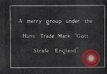 Image of British troops smiling beneath German sign in World War 1 France, 1917, second 1 stock footage video 65675027260