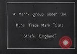 Image of British troops smiling beneath German sign in World War 1 France, 1917, second 3 stock footage video 65675027260