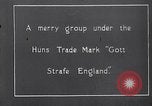 Image of British troops smiling beneath German sign in World War 1 France, 1917, second 5 stock footage video 65675027260