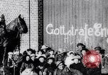 Image of British troops smiling beneath German sign in World War 1 France, 1917, second 6 stock footage video 65675027260