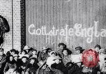 Image of British troops smiling beneath German sign in World War 1 France, 1917, second 9 stock footage video 65675027260