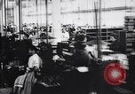 Image of French munitions factory workers in World War I France, 1915, second 16 stock footage video 65675027313