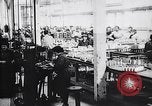Image of French munitions factory workers in World War I France, 1915, second 23 stock footage video 65675027313