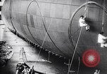 Image of French technicians assembling a dirigible France, 1916, second 25 stock footage video 65675027316