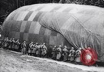 Image of French soldiers unfolding uninflated observation balloon France, 1916, second 58 stock footage video 65675027329