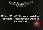 Image of Wilbur Wright adjusting transporter wheel on flyer United States USA, 1908, second 6 stock footage video 65675027433