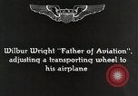 Image of Wilbur Wright adjusting transporter wheel on flyer United States USA, 1908, second 8 stock footage video 65675027433