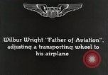 Image of Wilbur Wright adjusting transporter wheel on flyer United States USA, 1908, second 9 stock footage video 65675027433