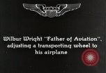 Image of Wilbur Wright adjusting transporter wheel on flyer United States USA, 1908, second 10 stock footage video 65675027433