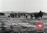 Image of Wilbur Wright adjusting transporter wheel on flyer United States USA, 1908, second 27 stock footage video 65675027433