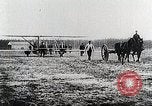 Image of Wilbur Wright adjusting transporter wheel on flyer United States USA, 1908, second 28 stock footage video 65675027433